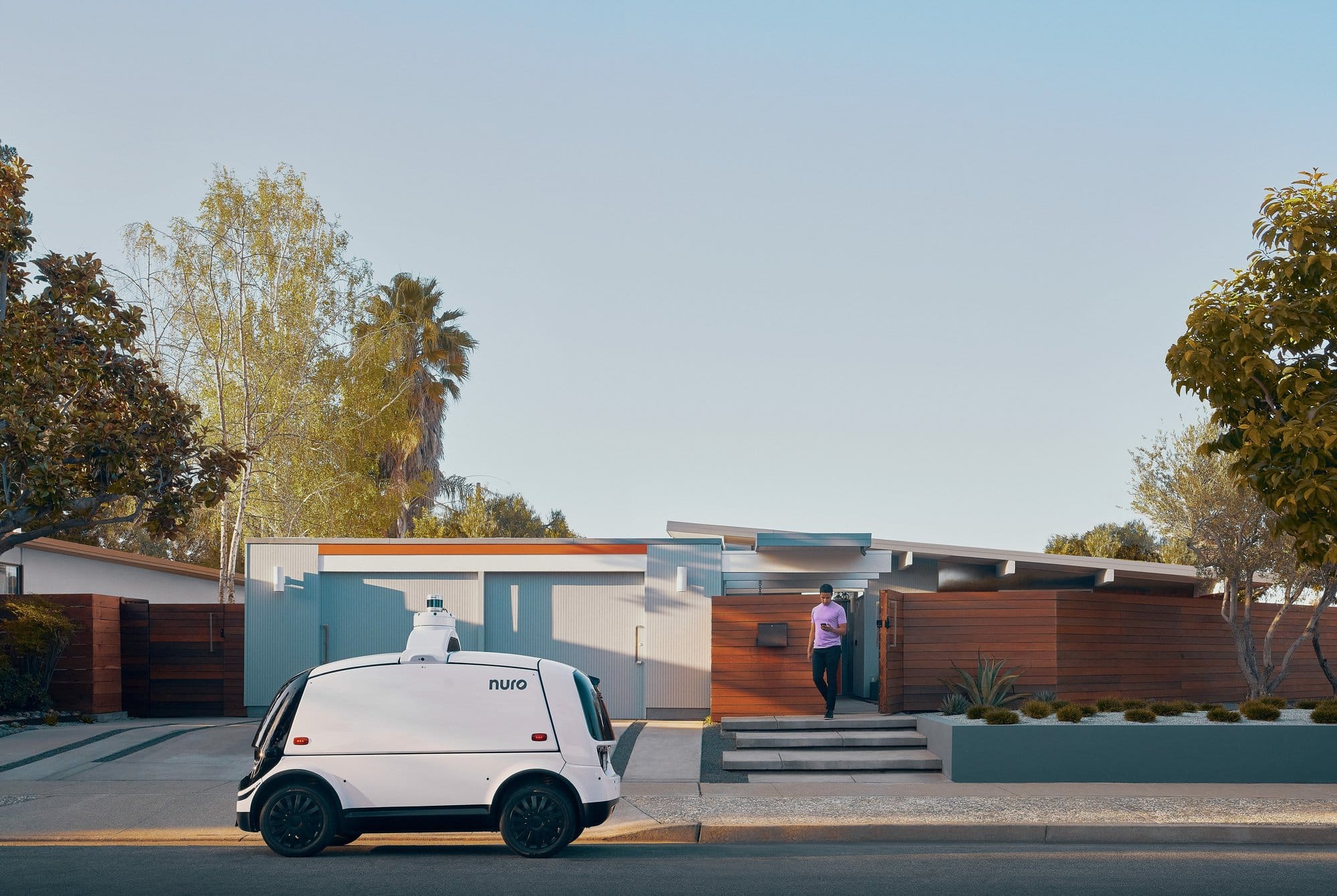 Nuro in front of the driveway
